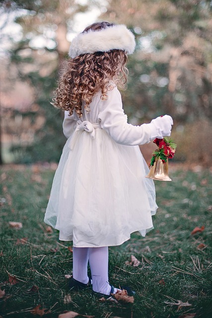 girl with christmas bell