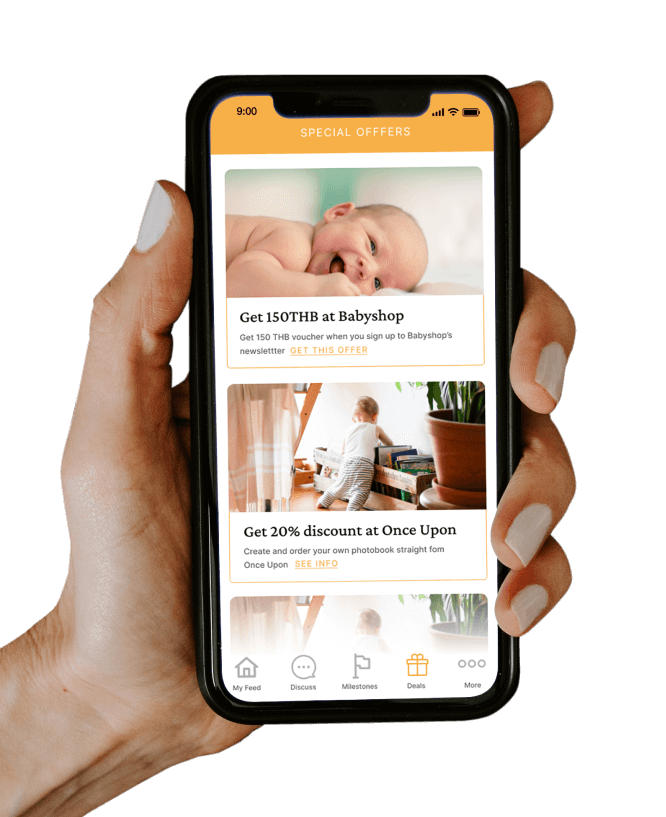 hand holding a mobile phone showing a pregnancy app