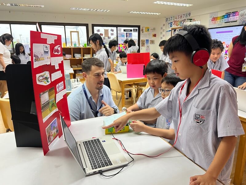 Boy working on a computer in a science classroom