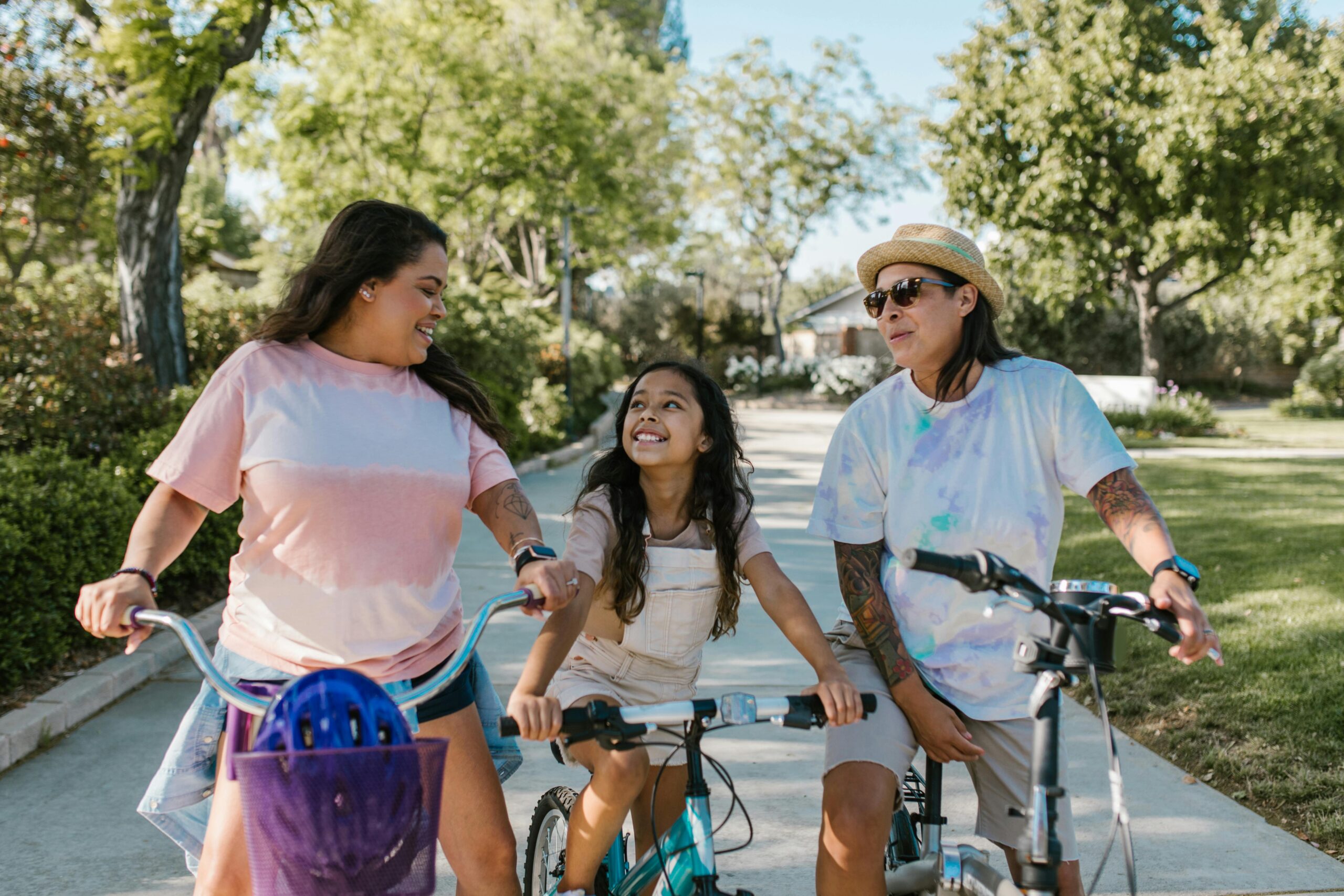 parents with a small child on electric bikes